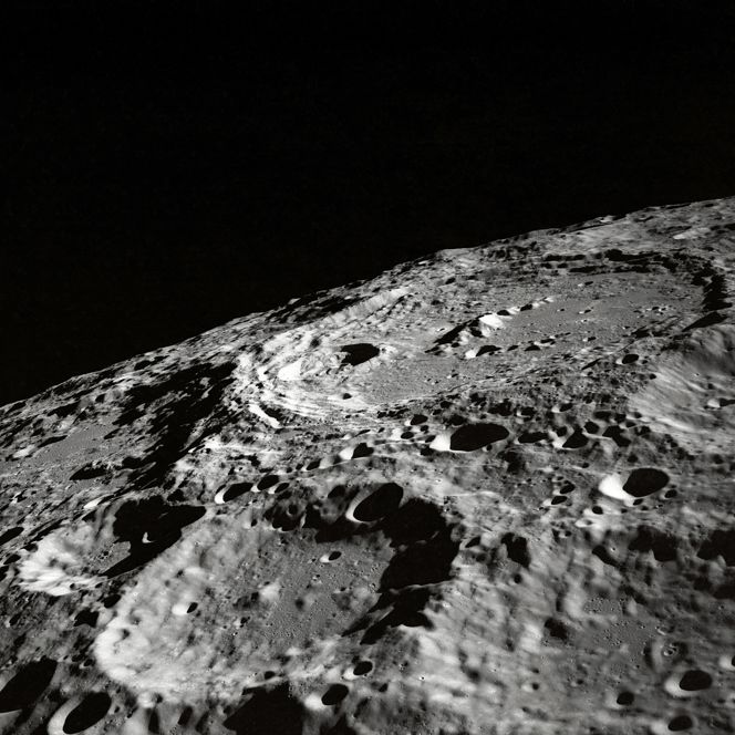 On the Moon, the landscape covered in what is called regolith - a mixture of dust, larger particles, and fragments. 